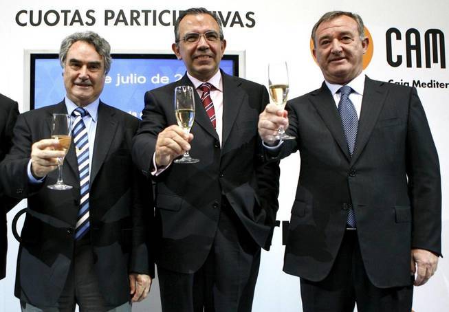 Ángel Martínez (i.). Roberto López Abad (c.) y Juan Ramón Avilés brindan por la salida a bolsa, en 2008 - 