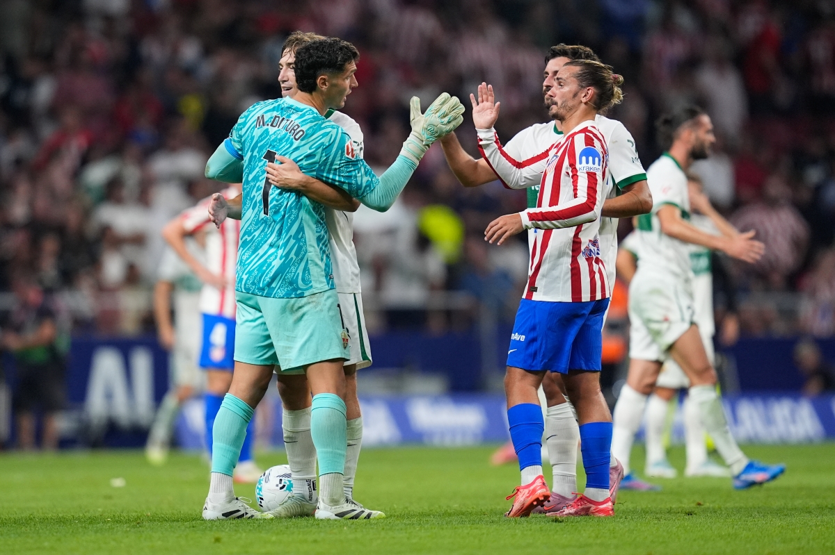 Dituro y Griezmann tras el encuentro de la primera vuelta con el Atlético de Madrid