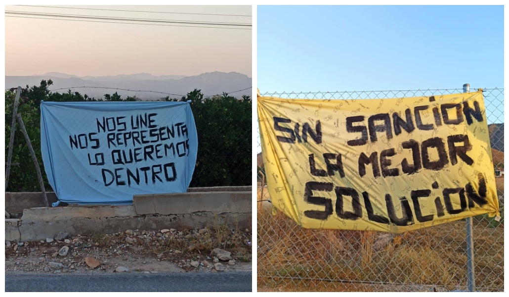 Pancartas en apoyo del delegado.