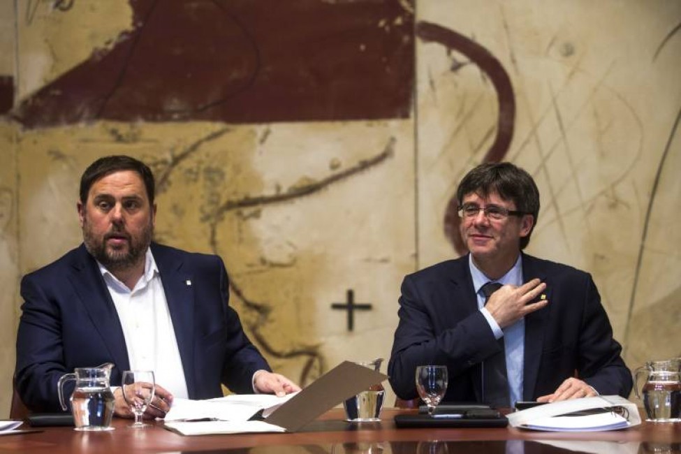 Oriol Junqueras (i.) y Carles Puigdemont - 